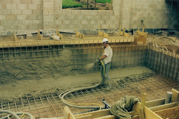 Our Sprayed Concrete team in action on a recent project - here the concrete is being applied to the reenforced steel against a simple back shutter.